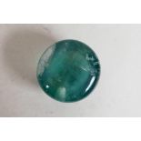 A 46.50ct green fluorite round cabochon, GJSPC certified, with certificate