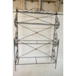 A painted, wrought metal three tier baker's/boulangerie rack, with brass mounts, lacks shelves,