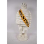 A large painted cast iron Michelin Man advertising figure, 21½" high