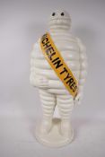 A large painted cast iron Michelin Man advertising figure, 21½" high