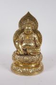 A Chinese gilt filled bronze Buddha seated on a lotus throne, impressed character marks to base,