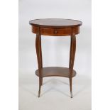 A C19th French tulipwood two tier occasional table, with parquetry inlaid top, shaped interior and