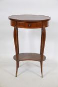 A C19th French tulipwood two tier occasional table, with parquetry inlaid top, shaped interior and