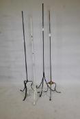 Four metal lamp stands, largest 63" high