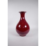 A Chinese flambe glazed porcelain pear shaped vase, 4 character mark to base, 12½" high
