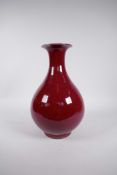 A Chinese flambe glazed porcelain pear shaped vase, 4 character mark to base, 12½" high