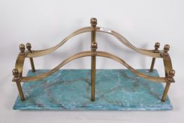 A brass magazine rack and a painted faux marble base, 22" x 9" x 12"