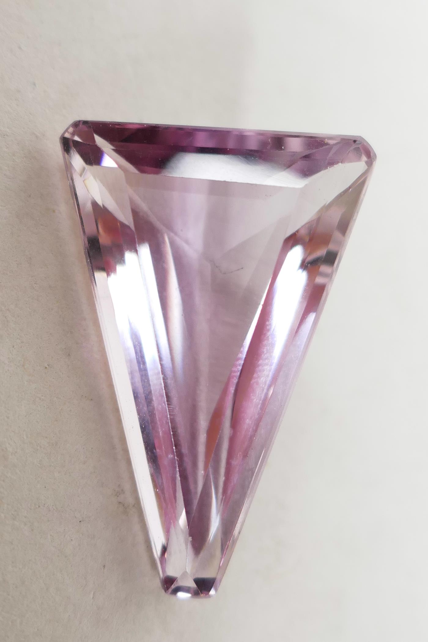 A 19.87ct natural amethyst, triangular GJSPC certified, with certificate