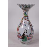 A C19th Chinese famille rose vase with wide flared rim decorated with figures and flowers in