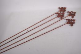 Four Gothic style iron plant stakes, 43" long