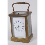 A French C19th brass cased repeater carriage clock with white enamel dial and painted Roman