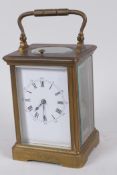 A French C19th brass cased repeater carriage clock with white enamel dial and painted Roman