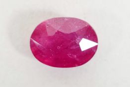 A 9.54ct ruby, oval mixed cut, IDT certified, with certificate