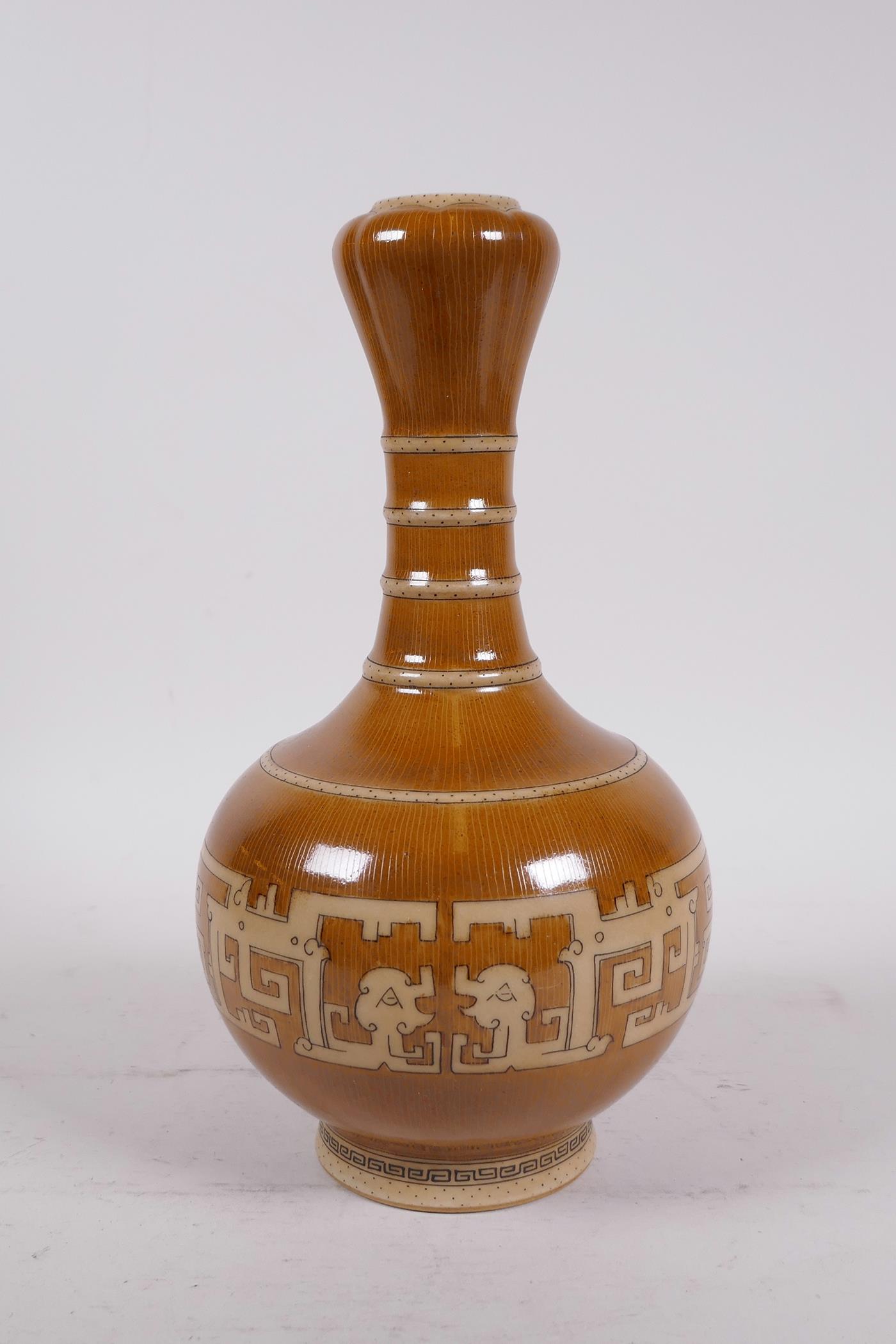 A Chinese garlic head shaped porcelain vase with archaic pattern and bamboo style decoration, seal