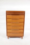 A White and Newton seven drawer 'semainier' teak chest, with moulded handles, 24" x 16" x 40"