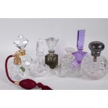 A collection of six perfume decanters including Waterford and hallmarked silver topped, together