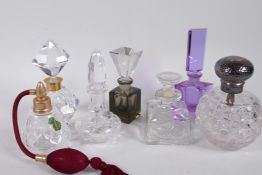 A collection of six perfume decanters including Waterford and hallmarked silver topped, together