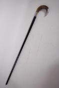 An ebony walking cane with horn handle and engraved hallmarked silver fittings (London 1927), 33"