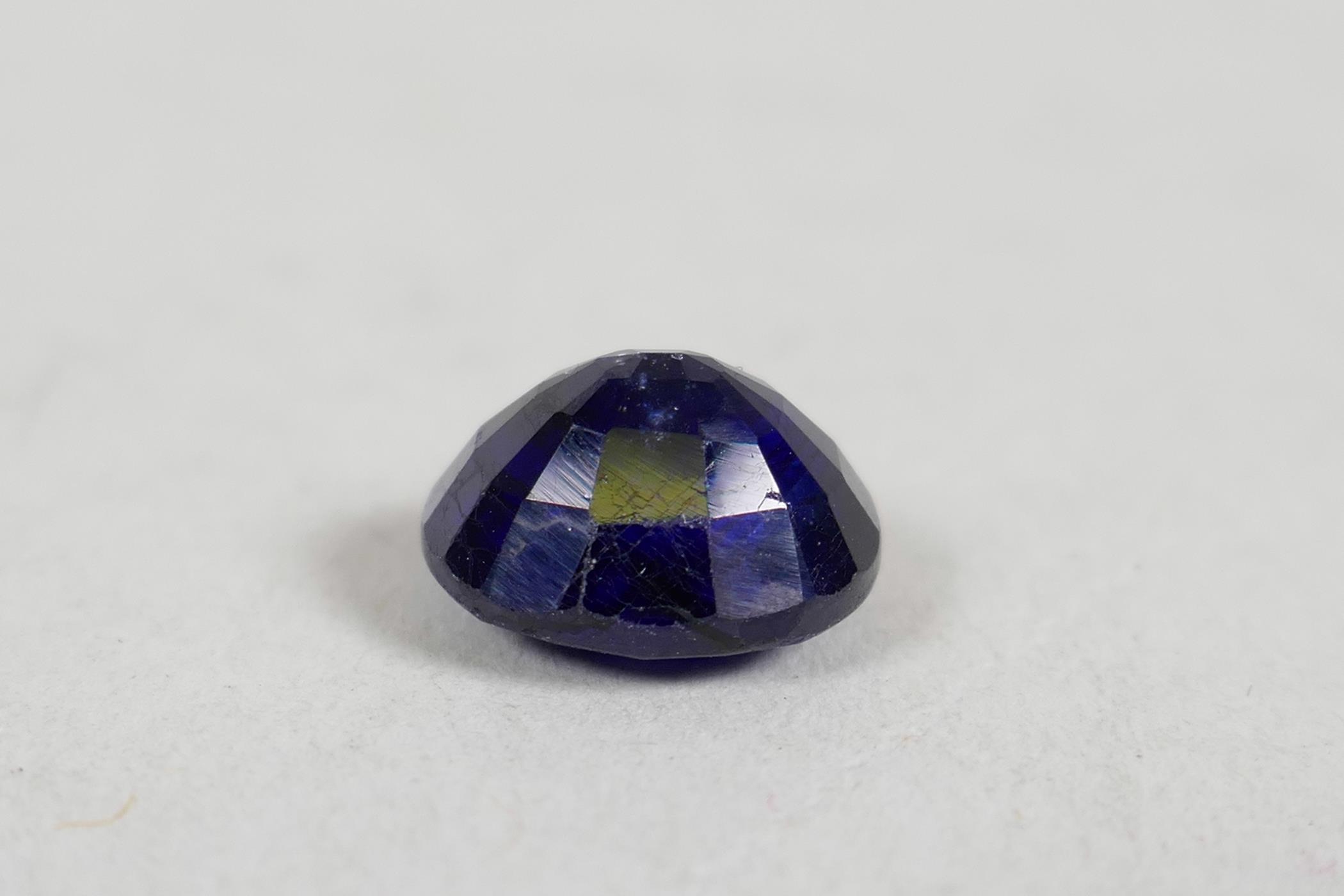 A 5.60ct blue sapphire, oval cushion cut, GJSPC certified, with certificate - Image 4 of 5