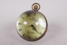 A glass and brass paperweight ball clock, 2¼" diameter