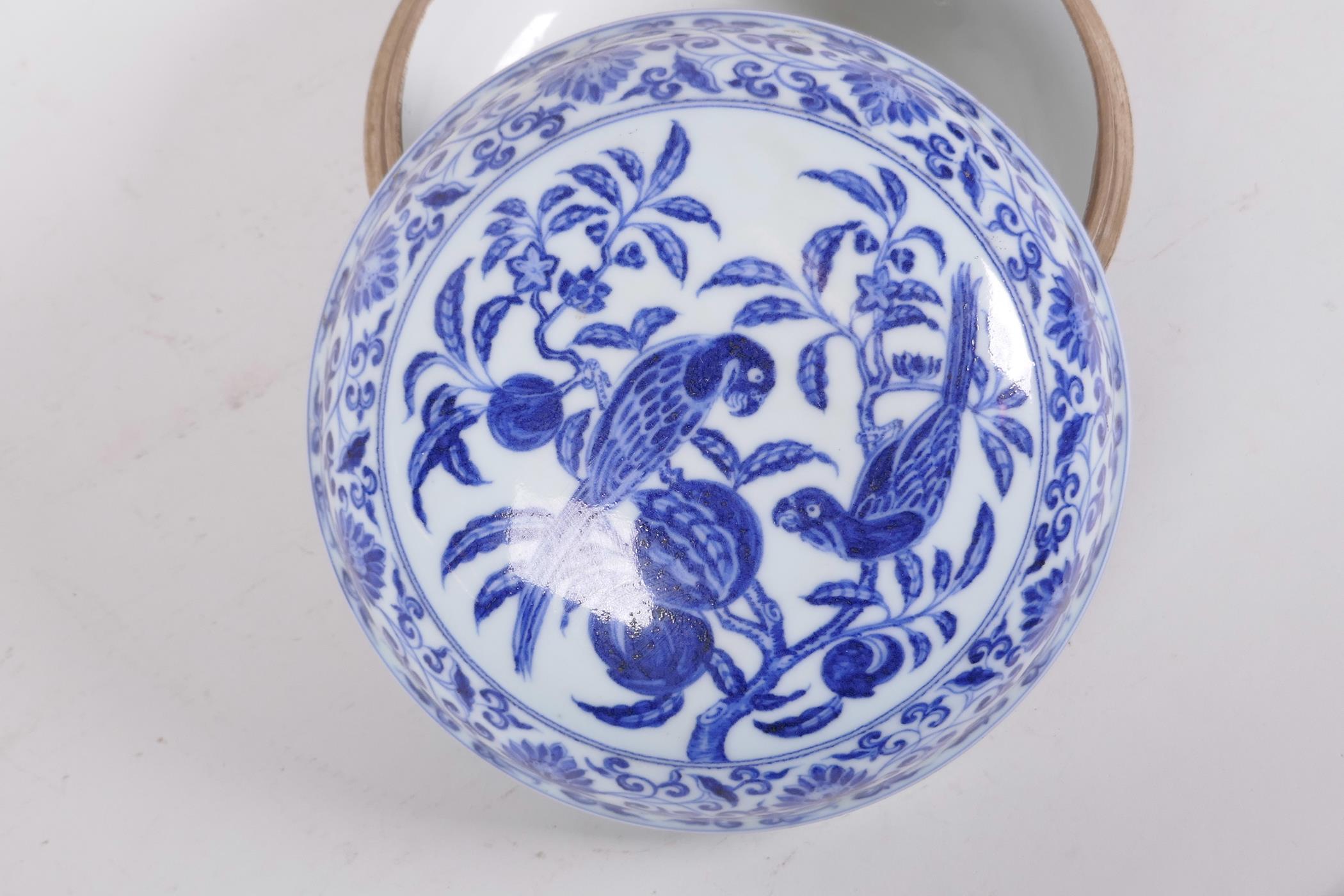 A Chinese blue and white porcelain cylinder box and cover decorated with birds in a fruit tree, 6 - Image 3 of 5