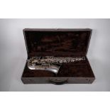 A vintage French J. Gras 'Prima' saxophone and travel case, 23½" x 10"