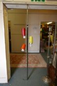 A mid century painted and chromed metal three spot light with a telescopic stand, 75" high,