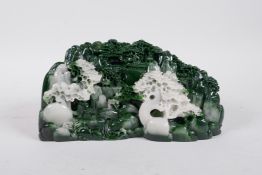 A Chinese reconstituted hardstone ornament carved to depict a mountain village landscape, 8½" long