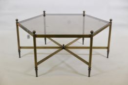 A hexagonal shaped brushed steel low table with tinted glass top, 34" x 17"