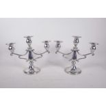 A pair of three branch pewter candelabra, 9½" high