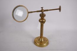 A brass industrial style worktop adjustable mirror, 4" diameter, 9½"