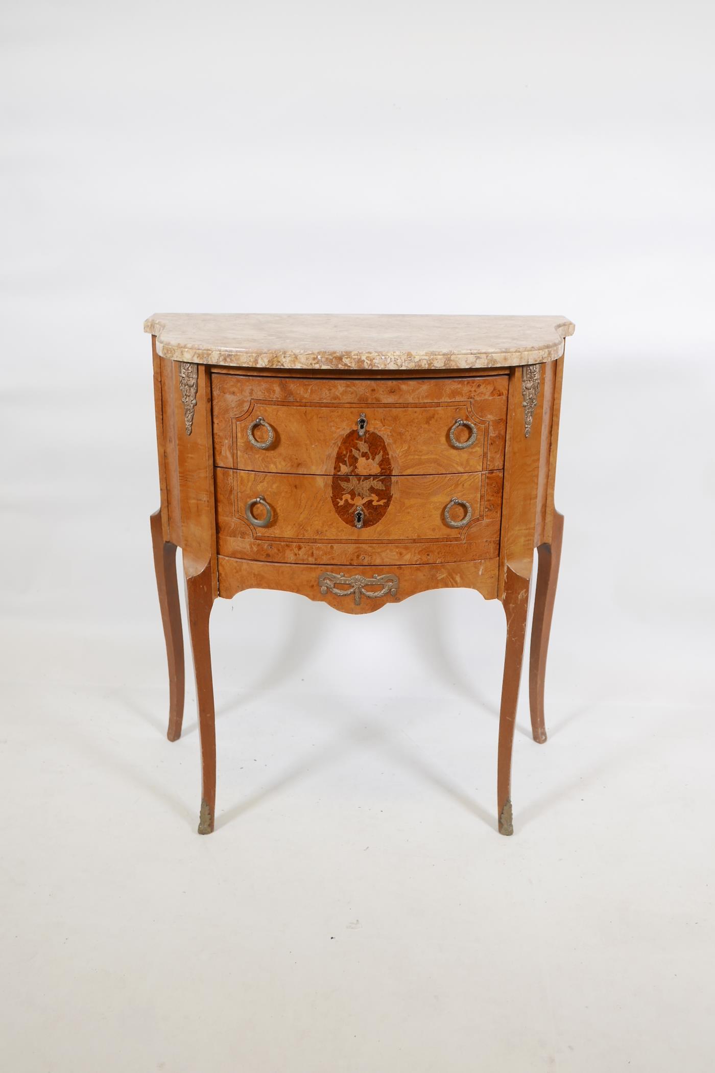 An inlaid burr walnut and elm two drawer bowfronted commode, with marble top and metal mounts,