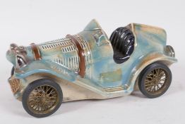 A Riprod Vietata C.C. Art 2598 pottery model of a 1924 Bugatti decanter made for D.V.M. Anisette