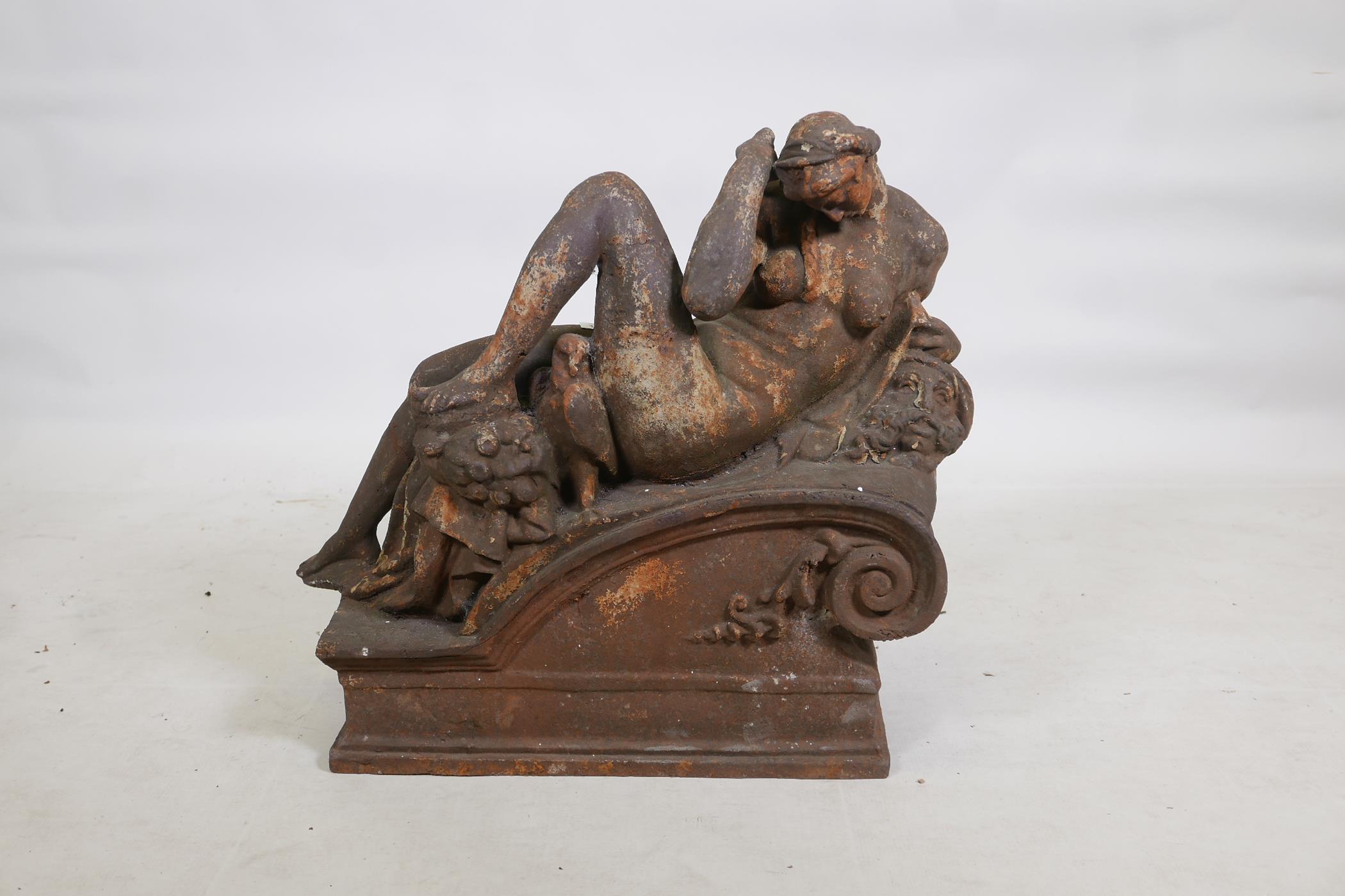 An early C19th hollow cast iron architectural feature in the form of a classical nude, remnants of