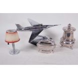 A 1950s/60s table lighter in the form of a fighter aircraft, a silver plated cigar lighter in the