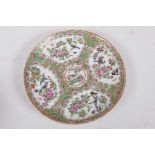 A Canton famille rose porcelain plate decorated with panels of birds, butterflies and flowers, 8"