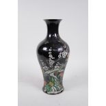 A Chinese famille noire porcelain vase decorated with birds and flowers, 6 character mark to base,