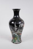 A Chinese famille noire porcelain vase decorated with birds and flowers, 6 character mark to base,