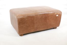 A brown leather pouffe, 36" x 25" x 16"