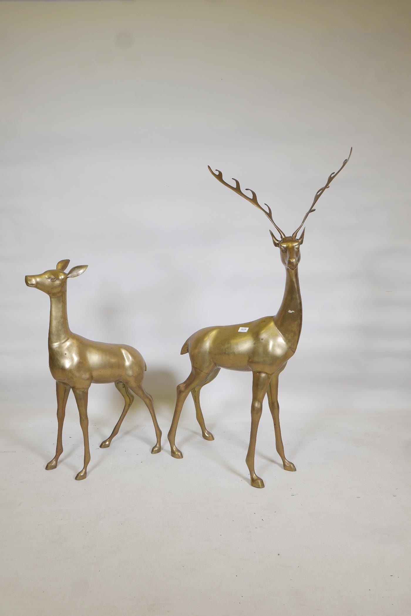 A hollow brass cast model of a buck and roe deer