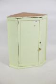 A C19th painted pine and fruitwood hanging corner cupboard, 21" x 27"