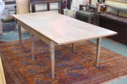 A hardwood dining table, raised on six tapering supports, 103" x 43" x 30"