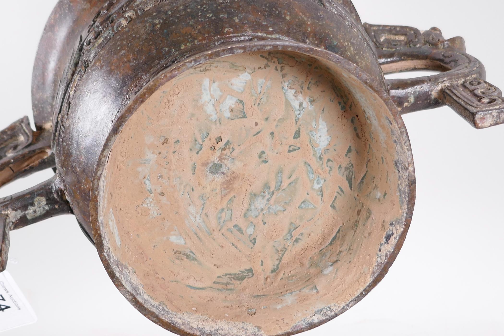 A Chinese bronze two handled censer with raised archaic style decoration, 12" x 6" high - Image 5 of 5