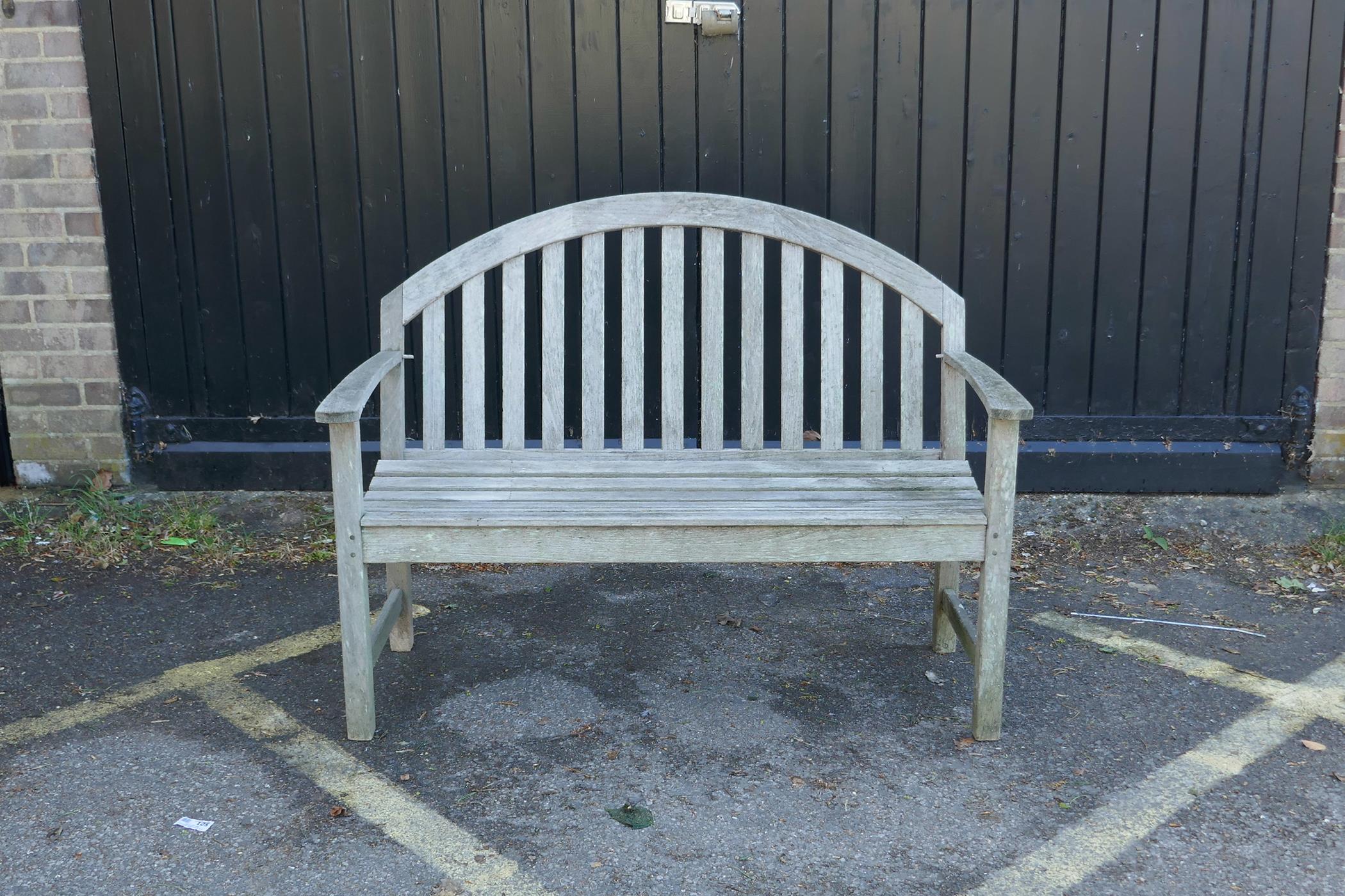 A Smith & Hawker teak garden bench, 48" wide