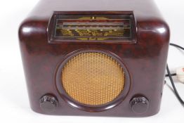 A vintage Bush Bakelite cased valve radio, type DAC 90A, 12" wide