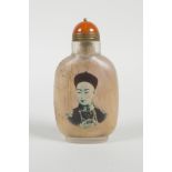 A Chinese reverse decorated glass snuff bottle depicting an emperor and a tree in blossom, 3½" high