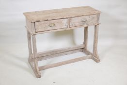 A stripped hardwood two drawer side table, 36" x 18", 28" high