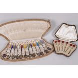 A boxed set of twelve Norwegian enamelled silver coffee spoons from R Iversen Bergen, one A/F,
