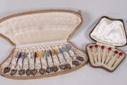 A boxed set of twelve Norwegian enamelled silver coffee spoons from R Iversen Bergen, one A/F,