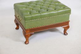 An oak and olive leather ottoman on cabriole supports with a deep buttoned top, 24" x 18", 15" high